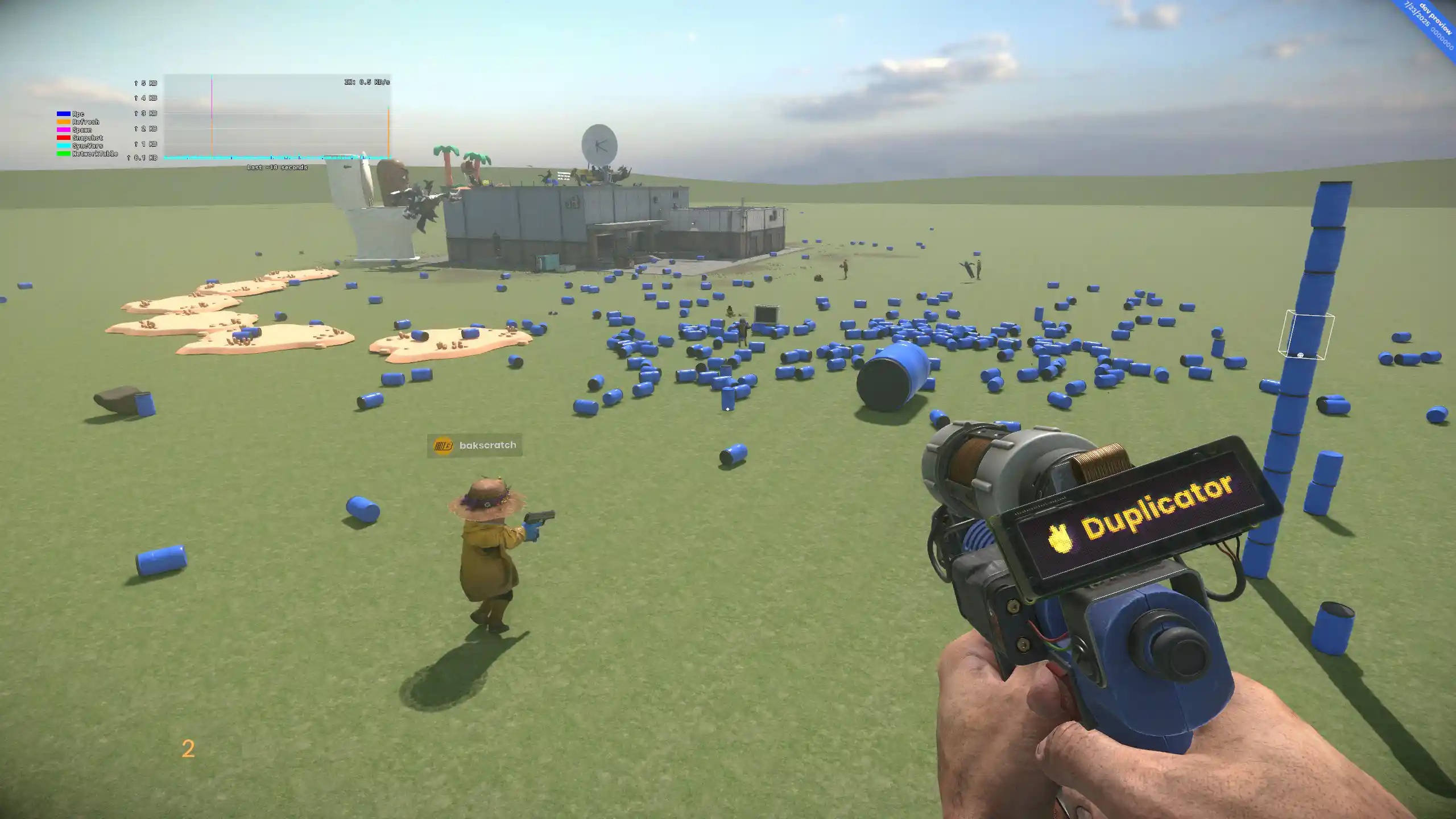 S&box sandbox gameplay showing the Duplicator tool and scattered blue props.